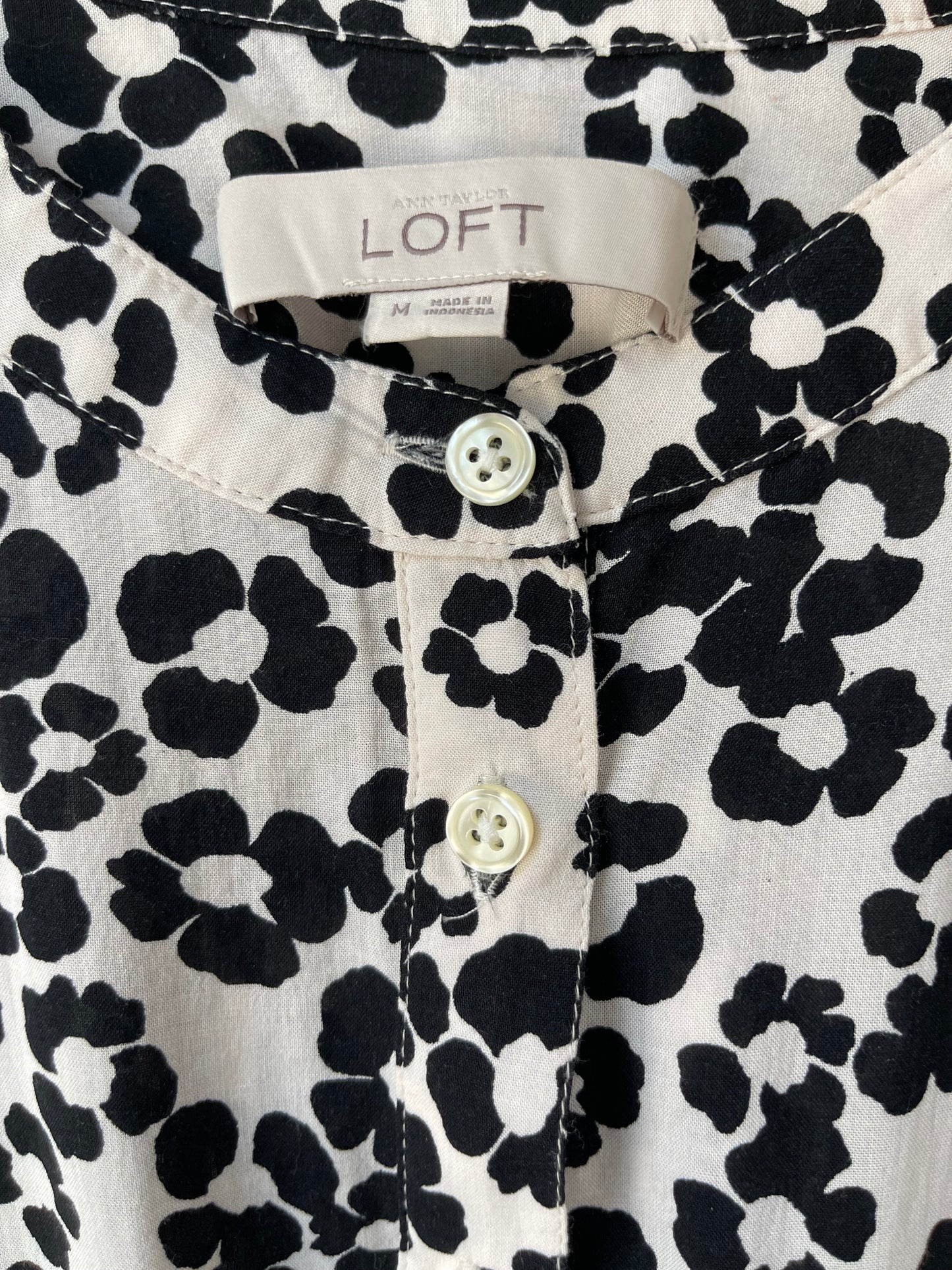 Blusa de manga larga con medio botón